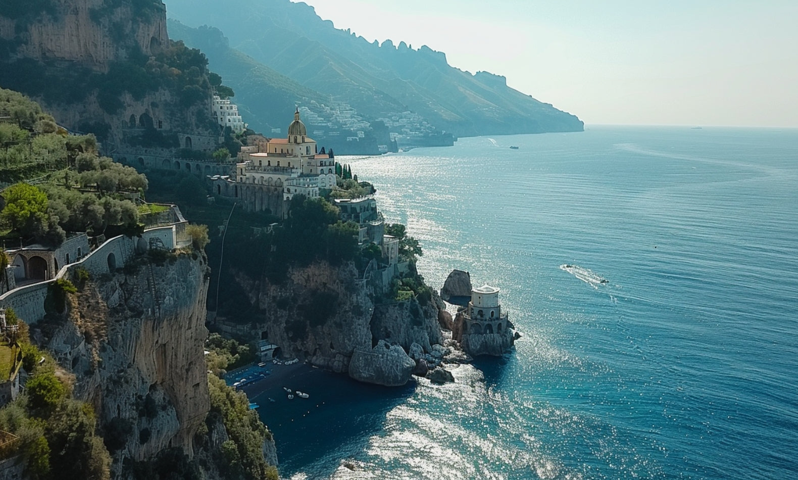 drone image of the amalfi coast of italy showing the lustrous ocean and cityscape